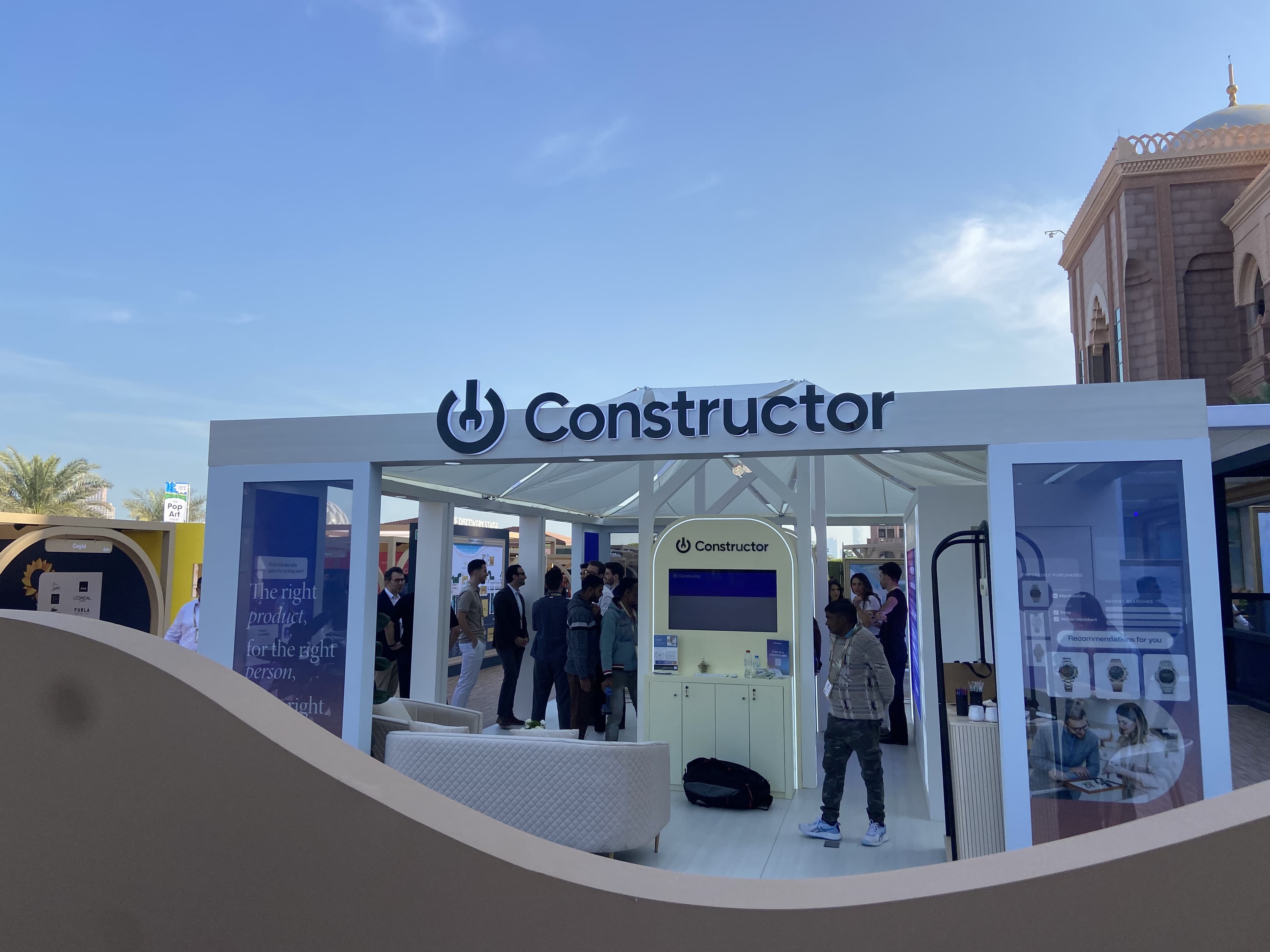 Constructor's stand at Shoptalk Luxe, with visitors inside it.